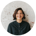 Clinical Psychologist Catherine Morey-Nase against a brick wall