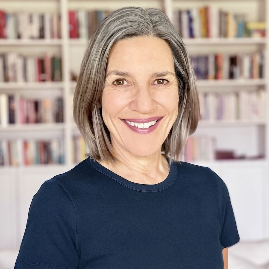 Kate James in front of a bookcase