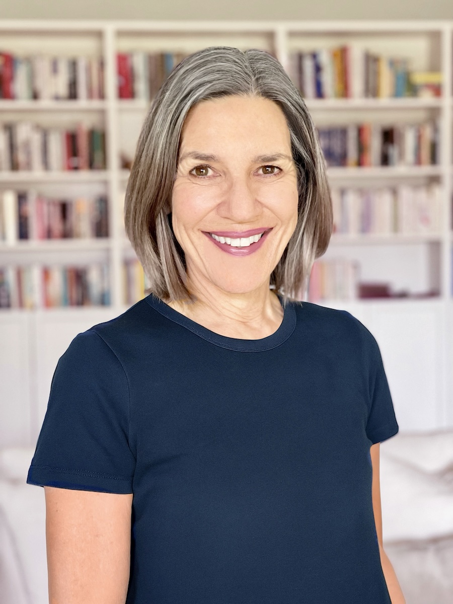 KateJames-Author,coach,mindfulness Kate James standing in front of a bookcase