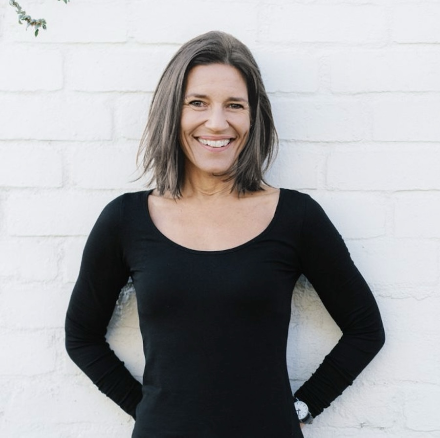 Kate James against brick wall