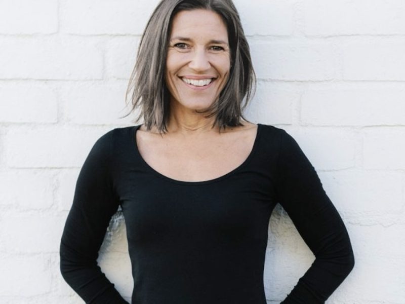 Kate James against brick wall