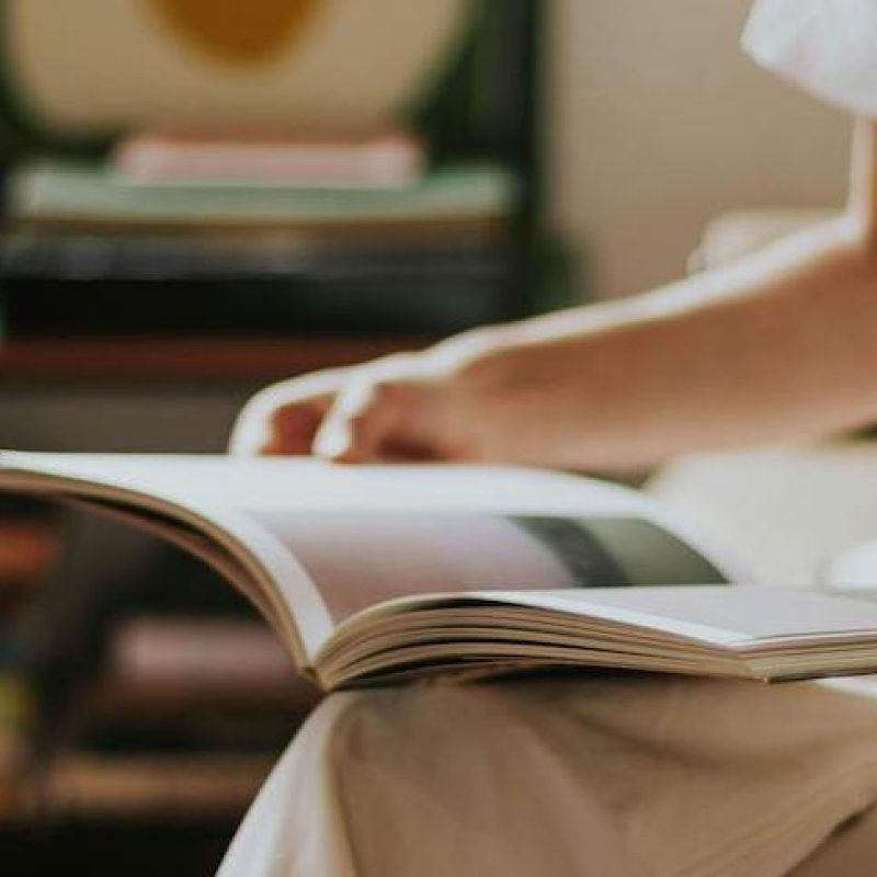 Woman with open book on her lap